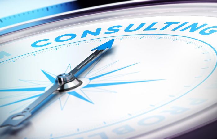 Compass with needle pointing the word consulting, blur effect and blue tones. Concept illustration of consultancy